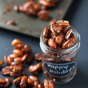 These gingerbread glazed roasted nuts use the traditional sweet and spicy flavour of gingerbread men to give a treat perfect for holiday parties or gifts via @ExSloth | ExSloth.com #Christmas
