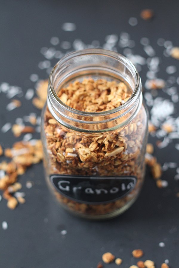 This coconut almond granola is easy to make, ready in under 30 minutes and full of delicious flavour. Plus, it's vegan, gluten free and refined sugar free via @ExSloth | ExSloth.com