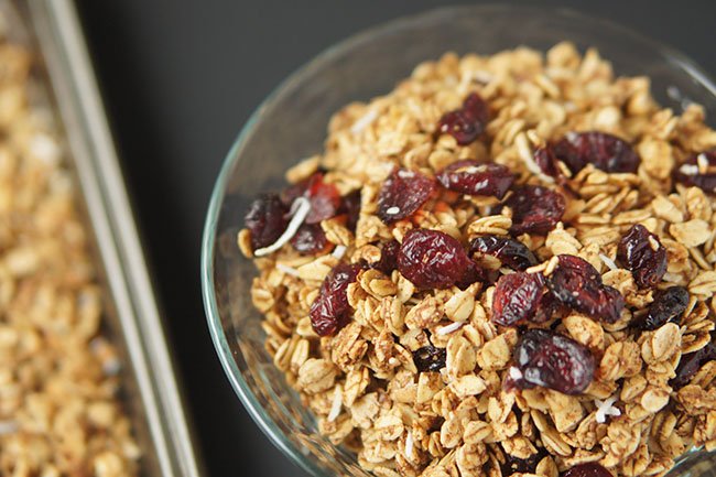 This slightly tart, mostly sweet Coconut Cranberry Orange Granola is gluten-free, vegan and ridiculously easy to make via @ExSloth | ExSloth.com