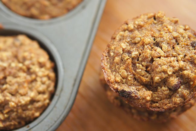 These dairy free carrot raisin oatmeal muffins contain no added sugars and are dense, chewy and wholesome. The raisins also add extra sweetness to each bite @ExSloth | ExSloth.com