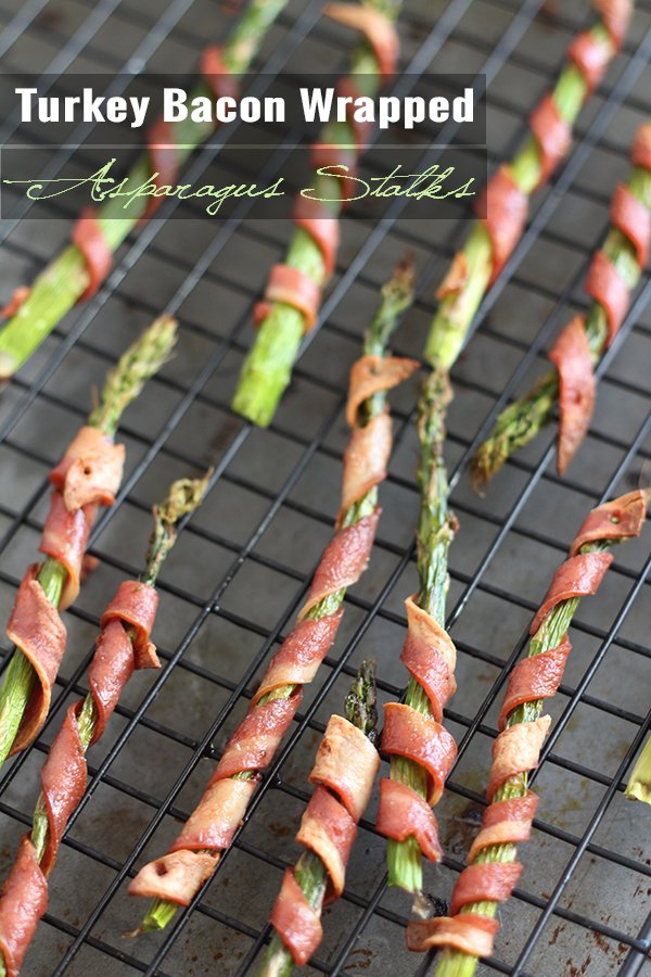 These turkey bacon wrapped asparagus stalks are simultaneously crunchy and tender, salty and sweet and only take 20 minutes in the oven via @ExSloth | ExSloth.com