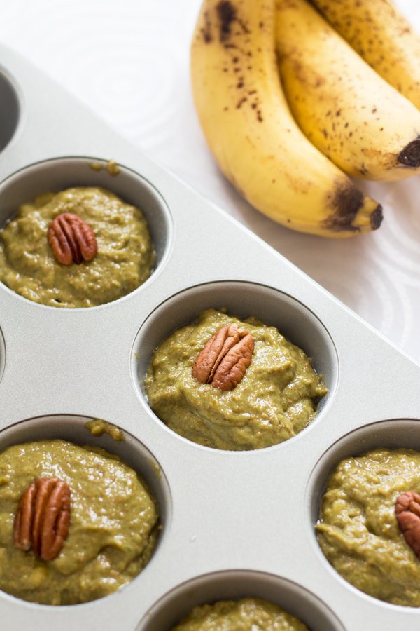 These Green Eggless Banana Muffins are also vegan, dairy-free, refined sugar-free and filled with spinach. Plus they use spelt flour instead of traditional wheat via @ExSloth | ExSloth