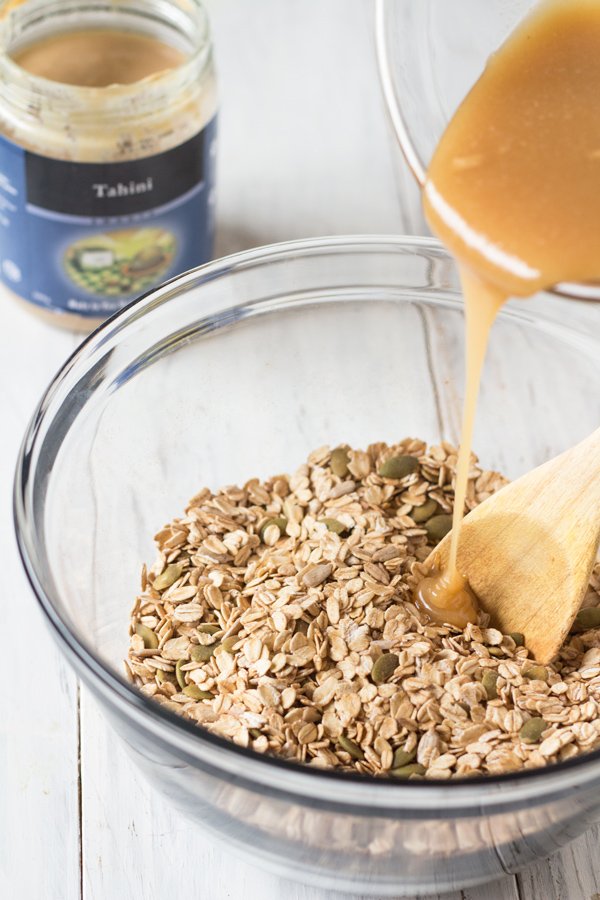 This Vegan Coconut Maple Tahini Granola is crunchy, satisfying and the perfect balance of sweet and savoury. Plus, it'll be ready in under 30 minutes. @ExSloth | ExSloth.com