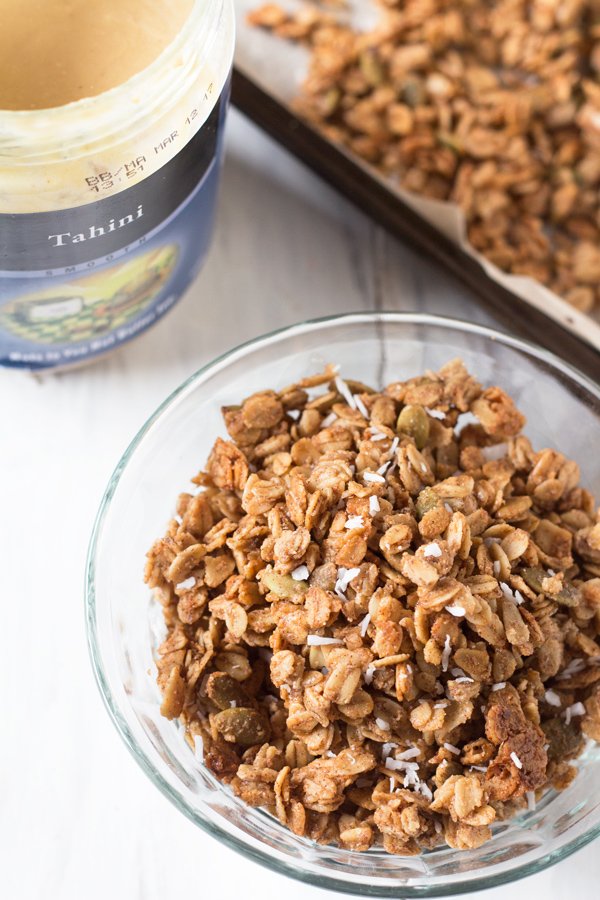 This Vegan Coconut Maple Tahini Granola is crunchy, satisfying and the perfect balance of sweet and savoury. Plus, it'll be ready in under 30 minutes. @ExSloth | ExSloth.com