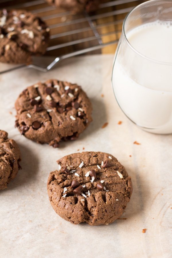 These vegan nut free brownie cookies have a light crust/crunch on the outside but are soft, chewy and basically brownie-like on the inside. Plus, they're made with coconut flour and sunflower seed butter so they're gluten-free and paleo via @ExSloth | ExSloth.com