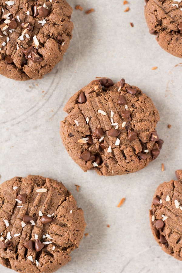 These vegan nut free brownie cookies have a light crust/crunch on the outside but are soft, chewy and basically brownie-like on the inside. Plus, they're made with coconut flour and sunflower seed butter so they're gluten-free and paleo via @ExSloth | ExSloth.com