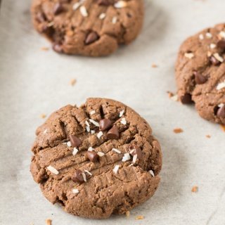These vegan brownie cookies have a light crust/crunch on the outside but are soft, chewy and basically brownie-like on the inside. Plus, they're made with coconut flour and sunflower seed butter so they're gluten-free, nut-free and paleo via @ExSloth | ExSloth.com