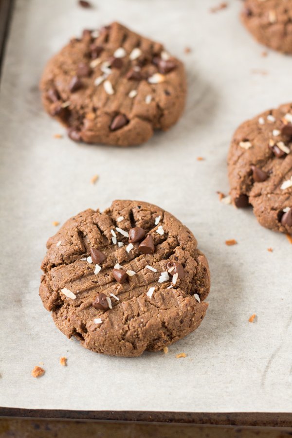 These vegan nut free brownie cookies have a light crust/crunch on the outside but are soft, chewy and basically brownie-like on the inside. Plus, they're made with coconut flour and sunflower seed butter so they're gluten-free and paleo via @ExSloth | ExSloth.com