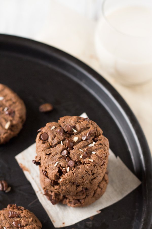 These vegan nut free brownie cookies have a light crust/crunch on the outside but are soft, chewy and basically brownie-like on the inside. Plus, they're made with coconut flour and sunflower seed butter so they're gluten-free and paleo via @ExSloth | ExSloth.com
