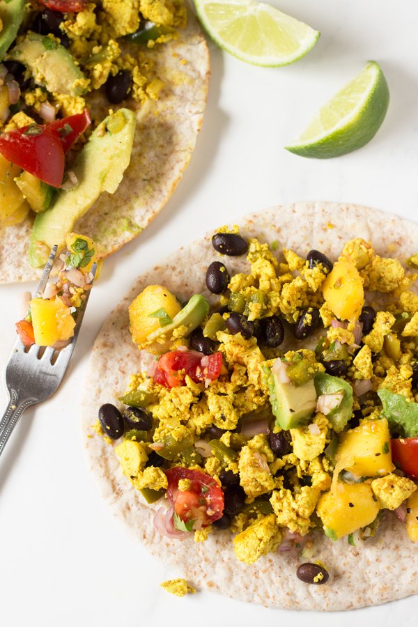 These vegan breakfast tacos are filling and flavourful, especially when topped with this super simple mango pineapple salsa via @ExSloth | ExSloth.com