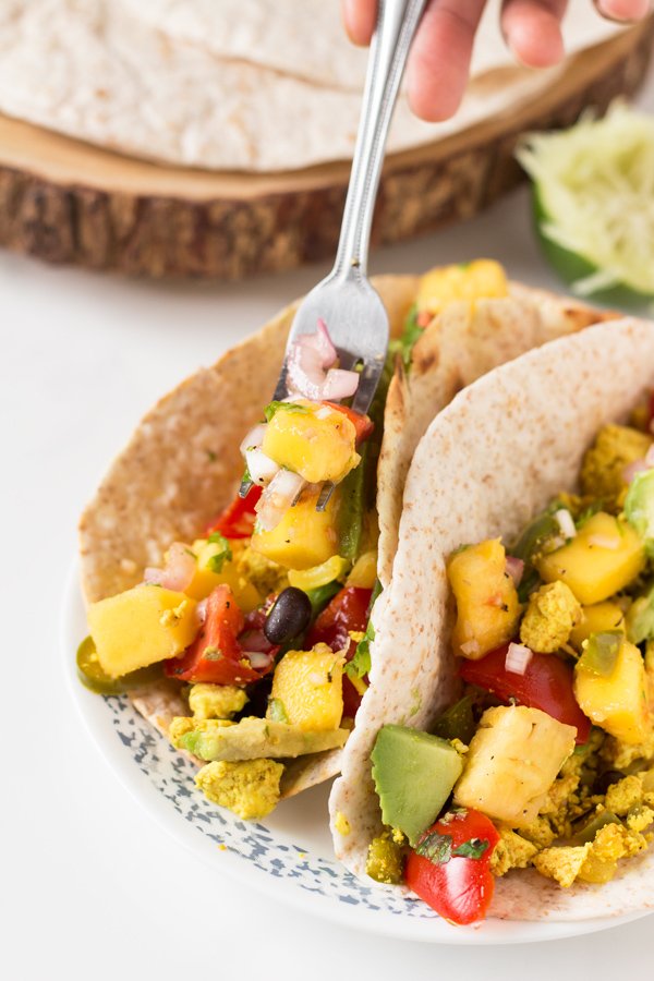 These vegan breakfast tacos are filling and flavourful, especially when topped with this super simple mango pineapple salsa via @ExSloth | ExSloth.com