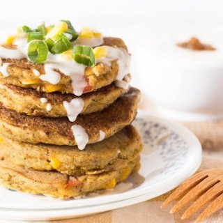 Zucchini Corn Savoury Pancakes (cornmeal pancakes) with spicy vegan sour cream. Perfect for breakfast, lunch and dinner. via @ExSLoth | ExSloth.com