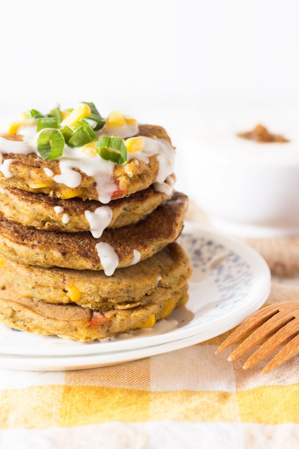 Zucchini Corn Savoury Pancakes (cornmeal pancakes) with spicy vegan sour cream. Perfect for breakfast, lunch and dinner. via @ExSLoth | ExSloth.com