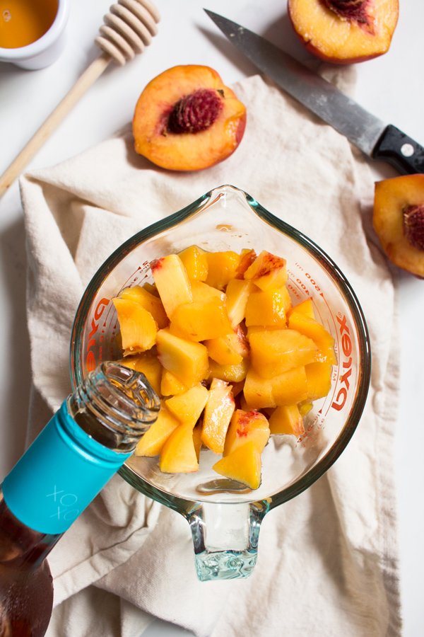 This creamy vegan peach rosé sorbet is perfectly sweet with a slight kick and doesn't require an ice cream maker via @ExSloth | ExSloth.com