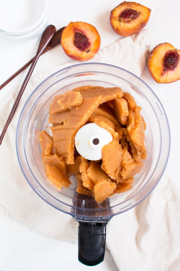 This creamy vegan peach rosé sorbet is perfectly sweet with a slight kick and doesn't require an ice cream maker via @ExSloth | ExSloth.com