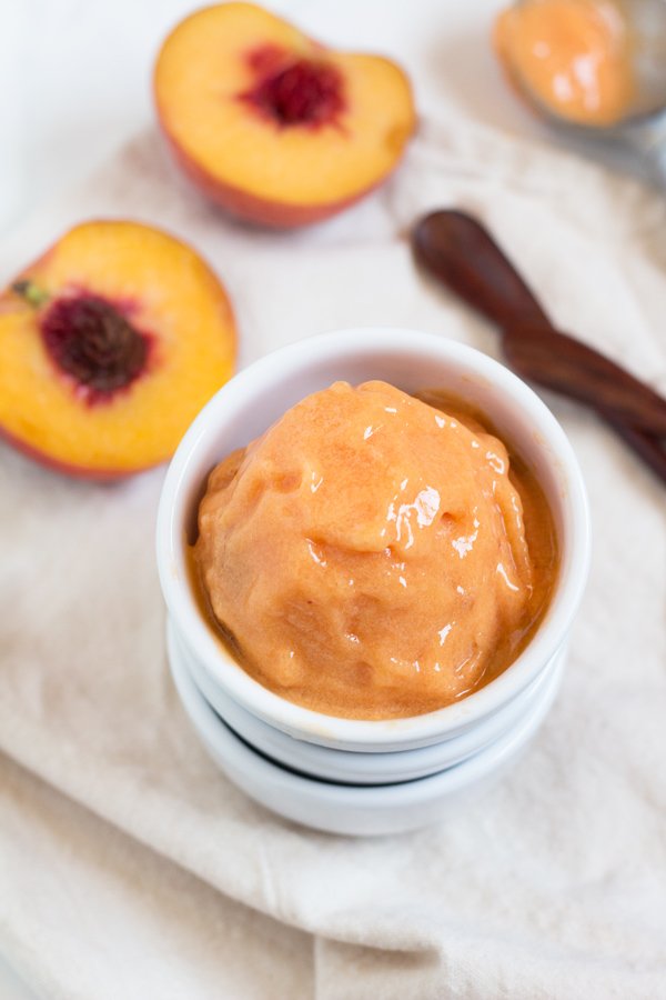 This creamy vegan peach rosé sorbet is perfectly sweet with a slight kick and doesn't require an ice cream maker via @ExSloth | ExSloth.com