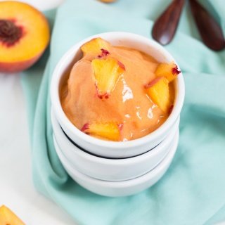 This creamy vegan peach rosé sorbet is perfectly sweet with a slight kick and doesn't require an ice cream maker via @ExSloth | ExSloth.com