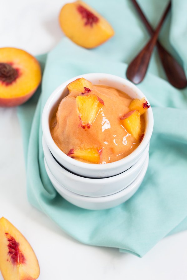 This creamy vegan peach rosé sorbet is perfectly sweet with a slight kick and doesn't require an ice cream maker via @ExSloth | ExSloth.com
