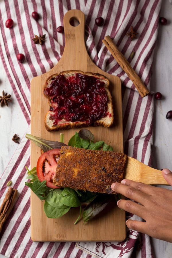 Crispy pan fried tofu with chai cranberry sauce (a vegan version of the classic Christmas or Thanksgiving leftovers sandwich) via ExSloth.com