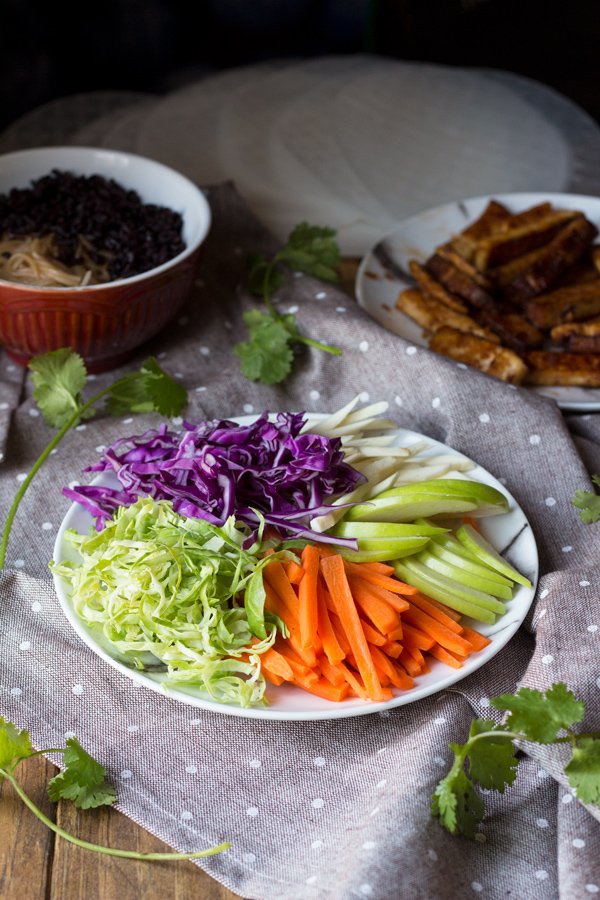 These baked rice paper rolls are hearty, flavourful , slightly crispy and perfectly sweet and spicy. A great gluten-free and vegan alternative to traditional spring rolls. via ExSloth.com