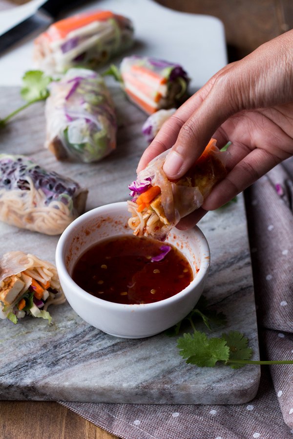 These baked rice paper rolls are hearty, flavourful , slightly crispy and perfectly sweet and spicy. A great gluten-free and vegan alternative to traditional spring rolls. via ExSloth.com