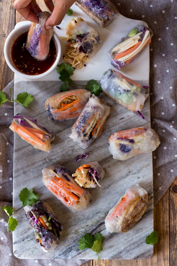 These baked rice paper rolls are hearty, flavourful , slightly crispy and perfectly sweet and spicy. A great gluten-free and vegan alternative to traditional spring rolls. via ExSloth.com