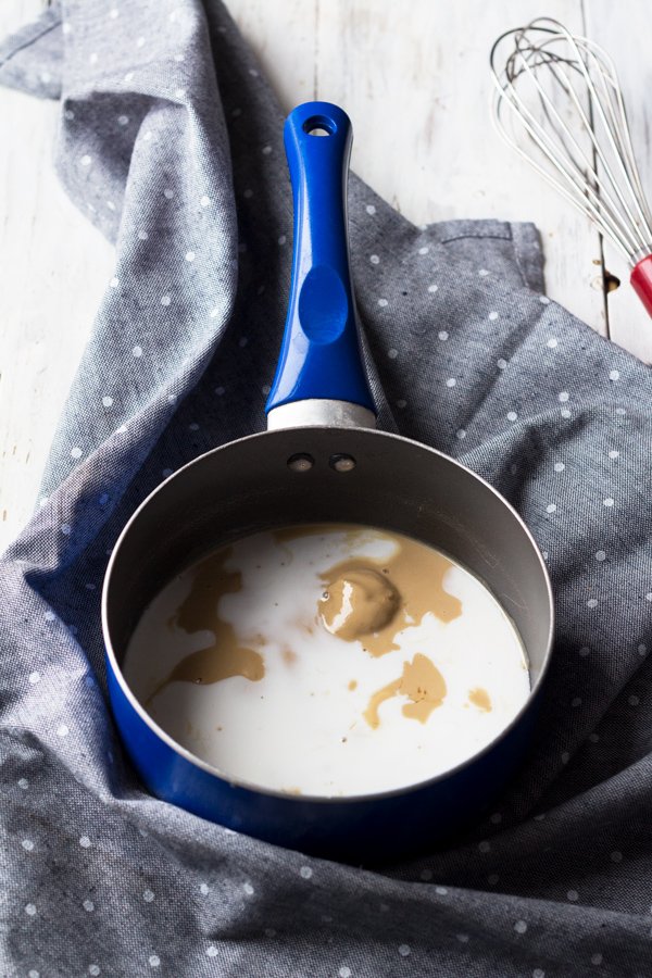 This tahini-based 5 ingredient vegan salted caramel sauce is smooth, creamy and perfect for drizzling. (Dairy free, paleo friendly and refined sugar free) via ExSloth.com