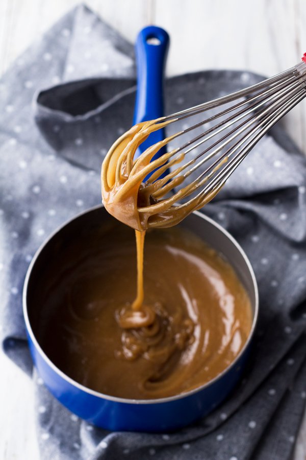 This tahini-based 5 ingredient vegan salted caramel sauce is smooth, creamy and perfect for drizzling. (Dairy free, paleo friendly and refined sugar free) via ExSloth.com