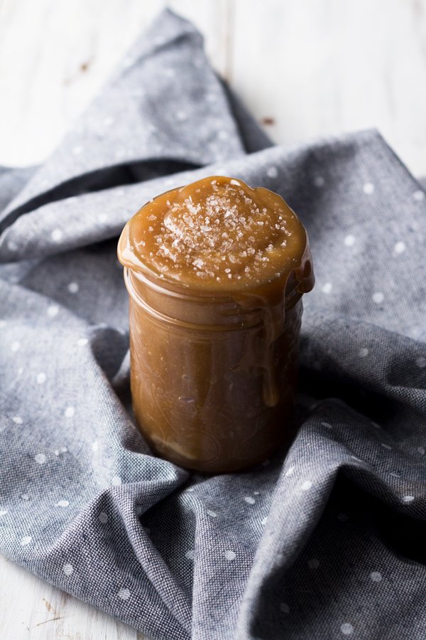 This tahini-based 5 ingredient vegan salted caramel sauce is smooth, creamy and perfect for drizzling. (Dairy free, paleo friendly and refined sugar free) via ExSloth.com