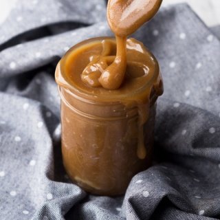 This tahini-based 5 ingredient vegan salted caramel sauce is smooth, creamy and perfect for drizzling. (Dairy free, paleo friendly and refined sugar free) via ExSloth.com