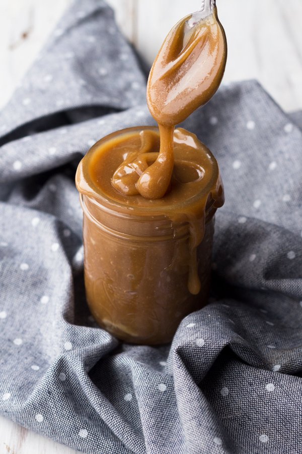 This tahini-based 5 ingredient vegan salted caramel sauce is smooth, creamy and perfect for drizzling. (Dairy free, paleo friendly and refined sugar free) via ExSloth.com