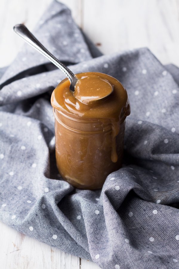 This tahini-based 5 ingredient vegan salted caramel sauce is smooth, creamy and perfect for drizzling. (Dairy free, paleo friendly and refined sugar free) via ExSloth.com