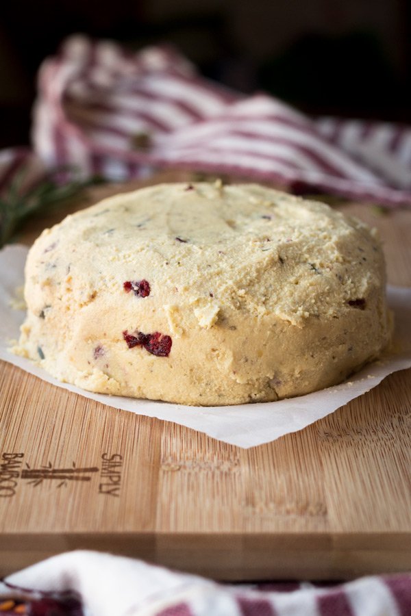 Vegan Lentil Cashew Cheese Ball - An easy vegan cheese recipe topped with cranberries and pumpkin seeds. Perfect for holiday or Christmas parties | ExSloth.com