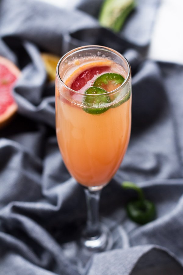 5 Ingredient Spicy Grapefruit Mimosa - perfect for everything from New Year's Eve brunch to Mother's Day via ExSloth.com