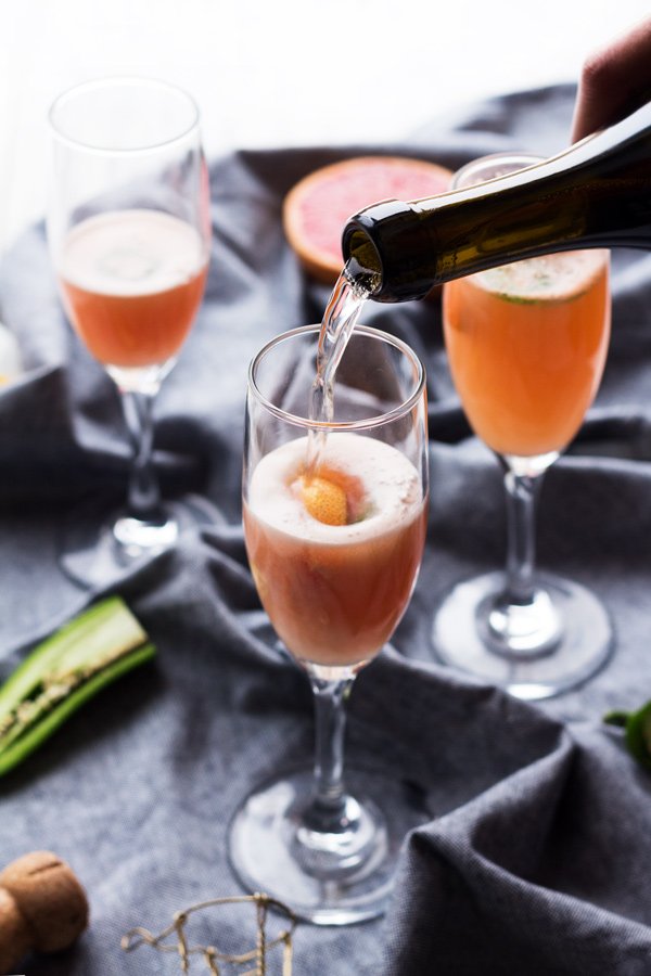 5 Ingredient Spicy Grapefruit Mimosa - perfect for everything from New Year's Eve brunch to Mother's Day via ExSloth.com