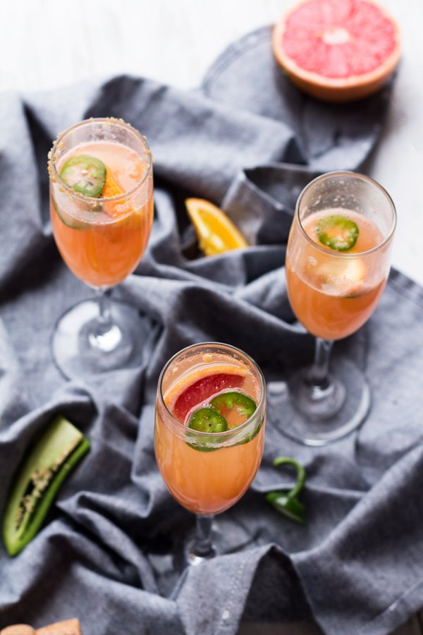 5 Ingredient Spicy Grapefruit Mimosa - perfect for everything from New Year's Eve brunch to Mother's Day via ExSloth.com