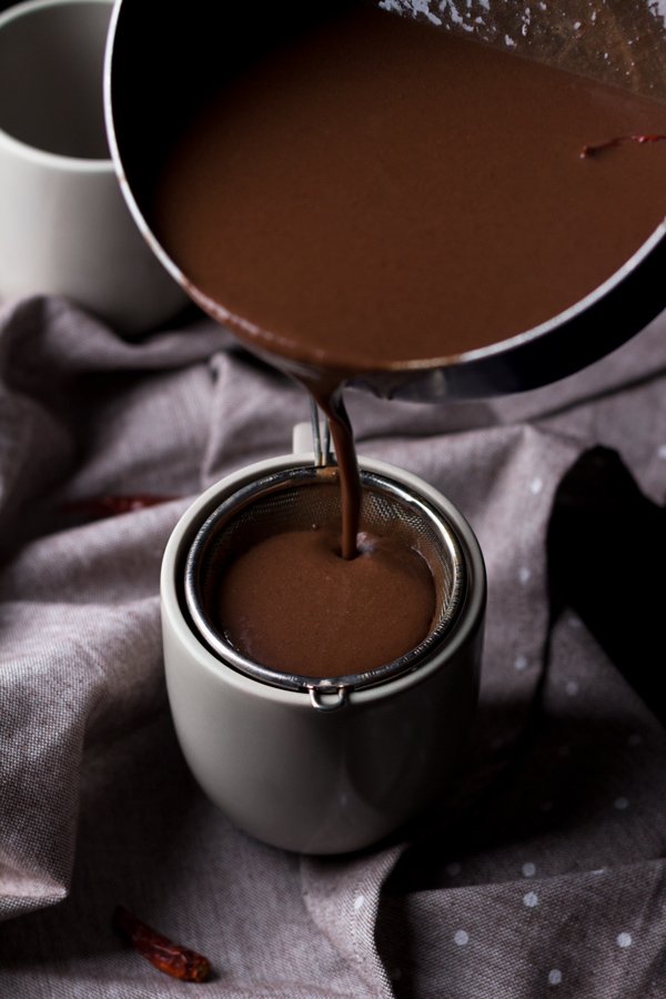 This tequila spiked Mexican hot chocolate is thick, creamy and perfectly spiced with a little kick from the tequila. It's also vegan, gluten-free and paleo (if you use 100% agave tequila) via ExSloth.com