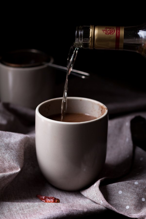 This tequila spiked Mexican hot chocolate is thick, creamy and perfectly spiced with a little kick from the tequila. It's also vegan, gluten-free and paleo (if you use 100% agave tequila) via ExSloth.com