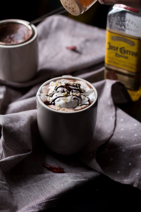 This tequila spiked Mexican hot chocolate is thick, creamy and perfectly spiced with a little kick from the tequila. It's also vegan, gluten-free and paleo (if you use 100% agave tequila) via ExSloth.com