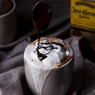 This tequila spiked Mexican hot chocolate is thick, creamy and perfectly spiced with a little kick from the tequila. It's also vegan, gluten-free and paleo (if you use 100% agave tequila) via ExSloth.com