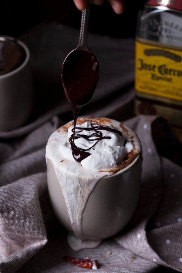 This tequila spiked Mexican hot chocolate is thick, creamy and perfectly spiced with a little kick from the tequila. It's also vegan, gluten-free and paleo (if you use 100% agave tequila) via ExSloth.com