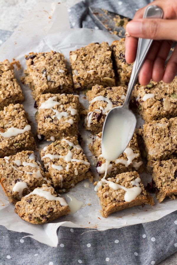 These coconut chai quinoa breakfast bars are vegan, gluten-free, refined sugar-free, filled with plant-based protein and can be made nut free depending on the mix-ins you use. They also make a great grab-and-go vegan breakfast | ExSloth.com