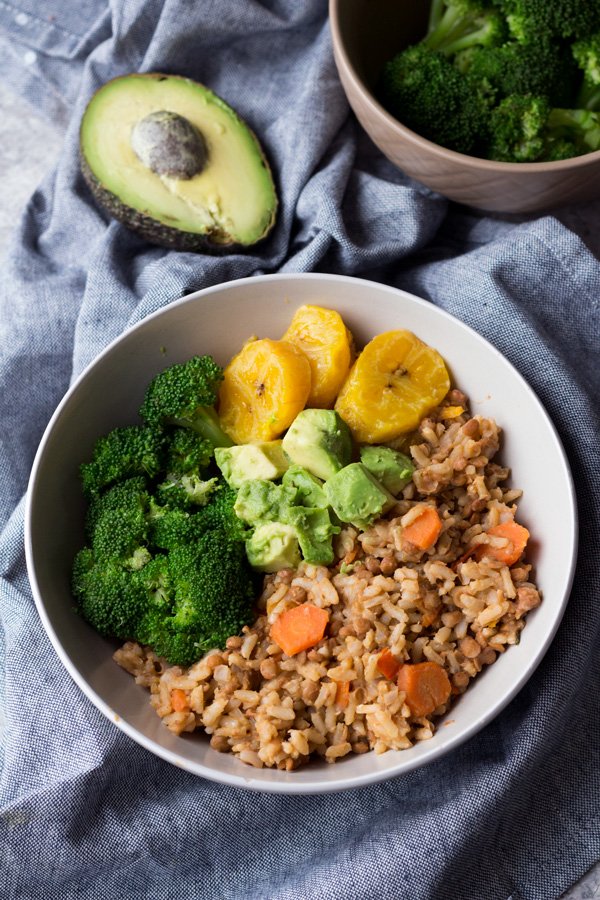This Trini-style slow cooker lentil rice bowl is filled with Trinidad inspired plant-based flavours and makes the perfect healthy vegan buddha bowl for lunch or dinner | ExSloth.com