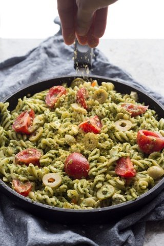 This easy vegan cilantro pesto pasta is flavourful, spicy, filling and calls for just 10 ingredients and about 25 minutes. Perfect vegan lunch or dinner | ExSloth.com
