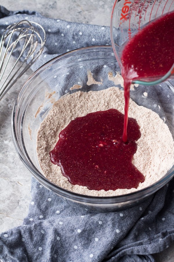 These vegan red velvet donuts are a delicious, healthy alternative to regular fried donuts and are great for Valentine's Day. The vegan cashew cream cheese frosting is also easy to make, creamy and perfectly sweet | ExSloth.com