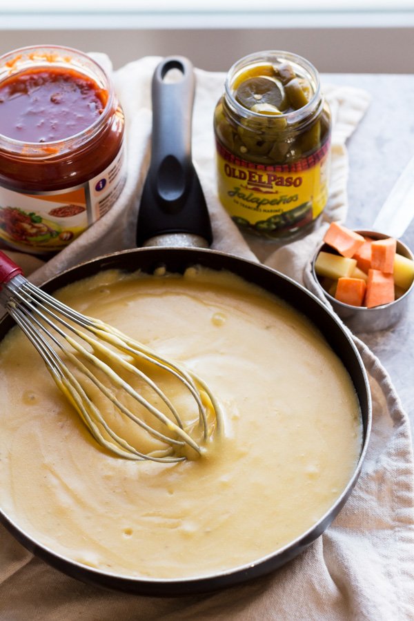 This nut-free vegan queso dip is made with potatoes instead of cashews but is just as creamy and flavourful | ExSloth.com