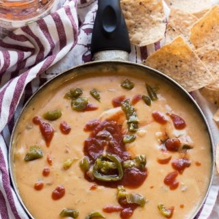This nut-free vegan queso dip is made with potatoes instead of cashews but is just as creamy and flavourful | ExSloth.com