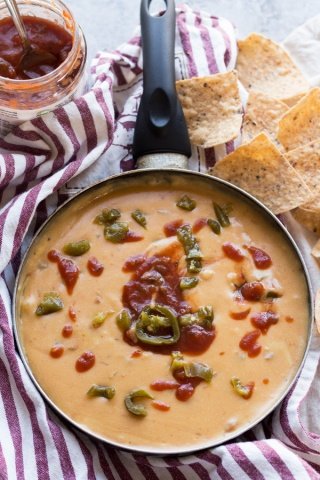This nut-free vegan queso dip is made with potatoes instead of cashews but is just as creamy and flavourful | ExSloth.com